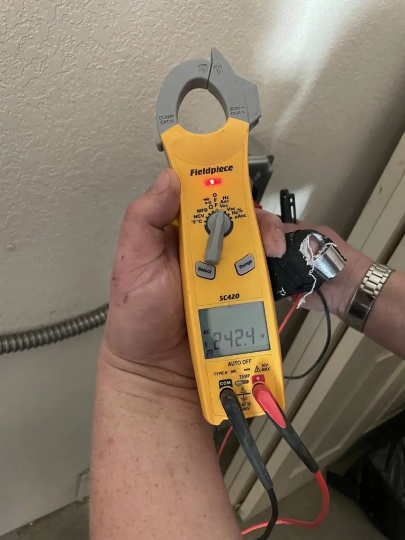 Voltage testing with clamp meter during Generator Installation in Auburn